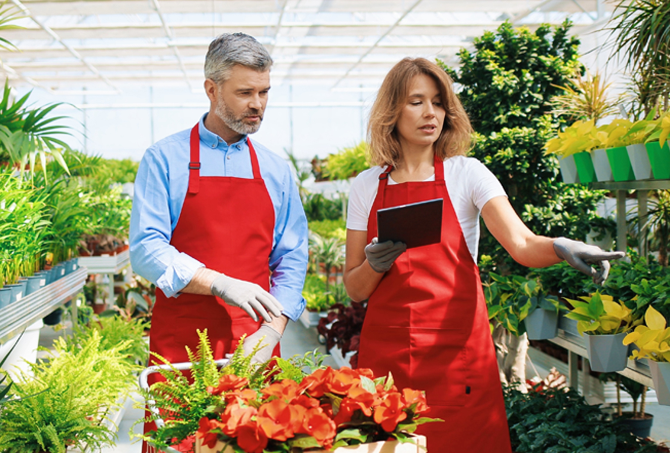 Couple taking inventory of plants and flowers